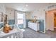 Bright Bedroom with a classic crib, soft lighting, and playful animal prints at 5004 Fern Mesa Ave # Lot 137, Las Vegas, NV 89139
