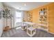 Bright home office features white desk, stylish shelving, and large window with a view at 5004 Fern Mesa Ave # Lot 137, Las Vegas, NV 89139