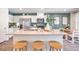 Modern kitchen featuring a quartz countertop island with seating and stainless steel appliances at 5004 Fern Mesa Ave # Lot 137, Las Vegas, NV 89139