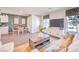 Open-concept living space with a modern sofa, dining area, and view into the kitchen for seamless living at 5004 Fern Mesa Ave # Lot 137, Las Vegas, NV 89139