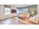 Cozy living room with lots of natural light, stylish decor, and comfortable seating arrangement at 5004 Fern Mesa Ave # Lot 137, Las Vegas, NV 89139
