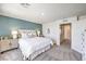 Main bedroom with a blue accent wall and view to the closet at 5004 Fern Mesa Ave # Lot 137, Las Vegas, NV 89139