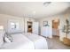 Bright, minimalist bedroom with a view into the bathroom and closet at 5004 Fern Mesa Ave # Lot 137, Las Vegas, NV 89139
