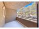 Cozy balcony featuring exterior views of neighborhood trees and blue skies at 5018 S Rainbow Blvd # 202, Las Vegas, NV 89118