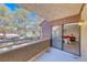 Exterior views of mature trees from the balcony of this home, with a peek into the primary bedroom at 5018 S Rainbow Blvd # 202, Las Vegas, NV 89118