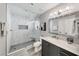 The updated bathroom features a marble tile shower, modern vanity, and a sleek frameless glass door at 5018 S Rainbow Blvd # 202, Las Vegas, NV 89118