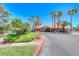 Community clubhouse featuring palm trees, desert landscaping and street access at 5018 S Rainbow Blvd # 202, Las Vegas, NV 89118