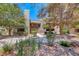 Charming condo exterior with mature trees and well maintained landscaping at 5018 S Rainbow Blvd # 202, Las Vegas, NV 89118