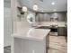 Modern kitchen features quartz countertops, stainless steel appliances, gray cabinets, and stylish pendant lighting at 5018 S Rainbow Blvd # 202, Las Vegas, NV 89118
