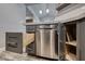 Contemporary kitchen with gray cabinets, stainless steel dishwasher, and open drawers with unique storage at 5018 S Rainbow Blvd # 202, Las Vegas, NV 89118