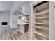 Open-concept space connects living area to kitchen with a pantry and a fireplace at 5018 S Rainbow Blvd # 202, Las Vegas, NV 89118