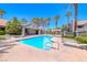 Community pool featuring pristine blue water and a relaxing lounge area at 5018 S Rainbow Blvd # 202, Las Vegas, NV 89118