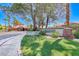 Community signage featuring desert landscaping, stacked stone features and beautiful greenery at 5018 S Rainbow Blvd # 202, Las Vegas, NV 89118
