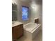 Bathroom featuring a soaking tub, double vanities, tile floors, and a privacy window with a floral pattern at 5055 Lime Kiln Ave, Las Vegas, NV 89139