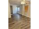Bonus room with built-in shelving, wood-look floors, and windows with wood-toned blinds at 5055 Lime Kiln Ave, Las Vegas, NV 89139