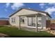 Well-maintained backyard featuring a covered patio, artificial turf, and low-maintenance landscaping at 516 Hamilton Dr # Lot 25, Mesquite, NV 89027