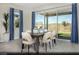 Bright dining area with patio access, modern furnishings, and stylish decor for a comfortable dining experience at 516 Hamilton Dr # Lot 25, Mesquite, NV 89027