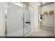Bright primary bathroom featuring a glass-enclosed shower with built-in seat and organized walk-in closet at 516 Hamilton Dr # Lot 25, Mesquite, NV 89027