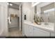 Modern primary bathroom with dual vanity sinks, white cabinets, and a walk-in closet at 516 Hamilton Dr # Lot 25, Mesquite, NV 89027