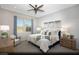 Cozy main bedroom with neutral colors, plush carpet, and a large window providing natural light at 516 Hamilton Dr # Lot 25, Mesquite, NV 89027