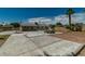 Spacious backyard featuring desert landscaping, a concrete patio, and shade trees at 5170 S Pearl St, Las Vegas, NV 89120