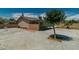 Backyard with patio, concrete area, some desert landscaping, and the rear of the home at 5170 S Pearl St, Las Vegas, NV 89120