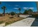 Spacious backyard featuring mature trees, a patio area, and a lawn at 5170 S Pearl St, Las Vegas, NV 89120