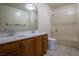 Well-lit bathroom featuring a double sink vanity and a shower-tub combo at 5170 S Pearl St, Las Vegas, NV 89120