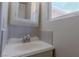 Bathroom featuring a well lit sink, mirror and window at 5170 S Pearl St, Las Vegas, NV 89120