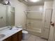 Bathroom featuring a double sink vanity, tile flooring, and shower over tub at 5170 S Pearl St, Las Vegas, NV 89120