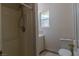 Cozy bathroom with shower, vanity, toilet, and a window offering natural light at 5170 S Pearl St, Las Vegas, NV 89120
