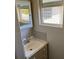 This bathroom features a vanity with mirror and a window at 5170 S Pearl St, Las Vegas, NV 89120