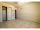 Inviting bedroom with tiled flooring, ceiling fan, and closet at 5170 S Pearl St, Las Vegas, NV 89120