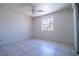 Serene bedroom with tiled flooring, closet space, and a bright window at 5170 S Pearl St, Las Vegas, NV 89120