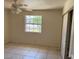 Bedroom featuring tiled floors, ceiling fan, and closet space at 5170 S Pearl St, Las Vegas, NV 89120