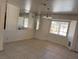 Dining room with a bay window, tiled floors, and a modern chandelier at 5170 S Pearl St, Las Vegas, NV 89120