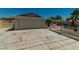 Spacious driveway leading to a single-story home with an attached garage at 5170 S Pearl St, Las Vegas, NV 89120