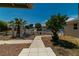 Charming front yard with mature trees and a well-maintained walkway at 5170 S Pearl St, Las Vegas, NV 89120