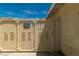 A view of the gate to the backyard with a 'Beware of Dog' sign at 5170 S Pearl St, Las Vegas, NV 89120