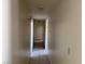 Hallway featuring tiled flooring and white paint at 5170 S Pearl St, Las Vegas, NV 89120