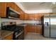 Well-equipped kitchen featuring stainless steel appliances and granite countertops at 5170 S Pearl St, Las Vegas, NV 89120