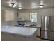 Kitchen featuring stainless steel refrigerator, gas range, and breakfast bar at 5170 S Pearl St, Las Vegas, NV 89120