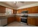 Well-lit kitchen with stainless steel appliances and ample cabinet space at 5170 S Pearl St, Las Vegas, NV 89120