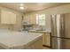Kitchen with stainless steel refrigerator and ample counter space at 5170 S Pearl St, Las Vegas, NV 89120