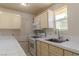 Functional kitchen with white appliances and abundant natural light at 5170 S Pearl St, Las Vegas, NV 89120