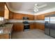 Spacious kitchen featuring stainless steel appliances and wood cabinets at 5170 S Pearl St, Las Vegas, NV 89120