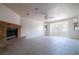 Spacious living room with tile floors and a brick fireplace, perfect for cozy evenings at 5170 S Pearl St, Las Vegas, NV 89120