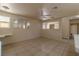 View of the living room with tile floors and attached kitchen at 5170 S Pearl St, Las Vegas, NV 89120