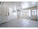 Bright living room with tiled flooring, a ceiling fan, and abundant natural light at 5170 S Pearl St, Las Vegas, NV 89120