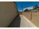An image of the side yard featuring a long concrete driveway to the backyard at 5170 S Pearl St, Las Vegas, NV 89120